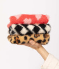Photo de trois pulls de la marque The Furry Folks.